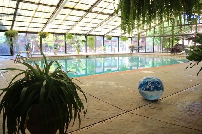 The pool is in a solarium.